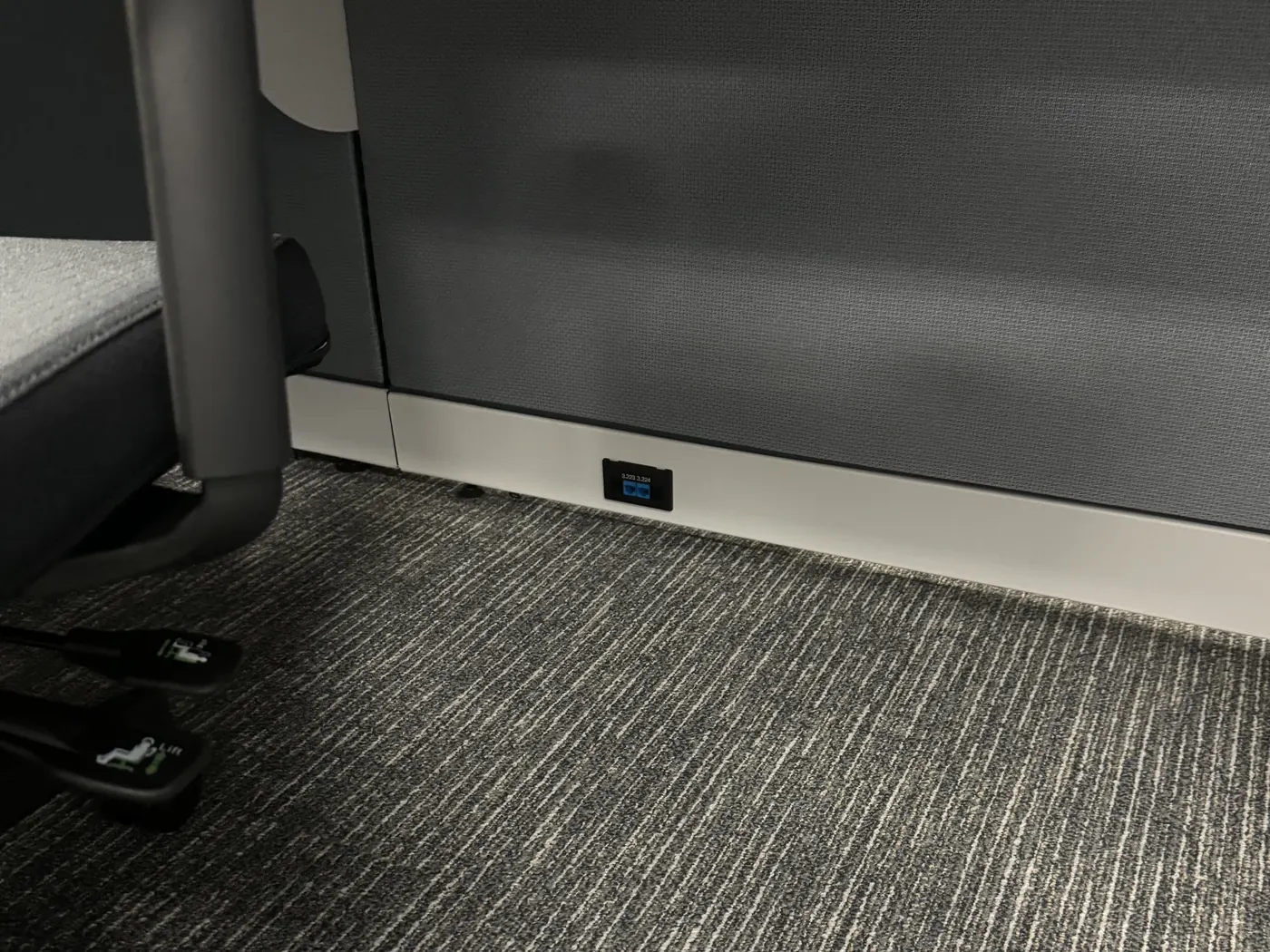 Dual Category 6A station outlet with machine-printed labels in a workstation base raceway